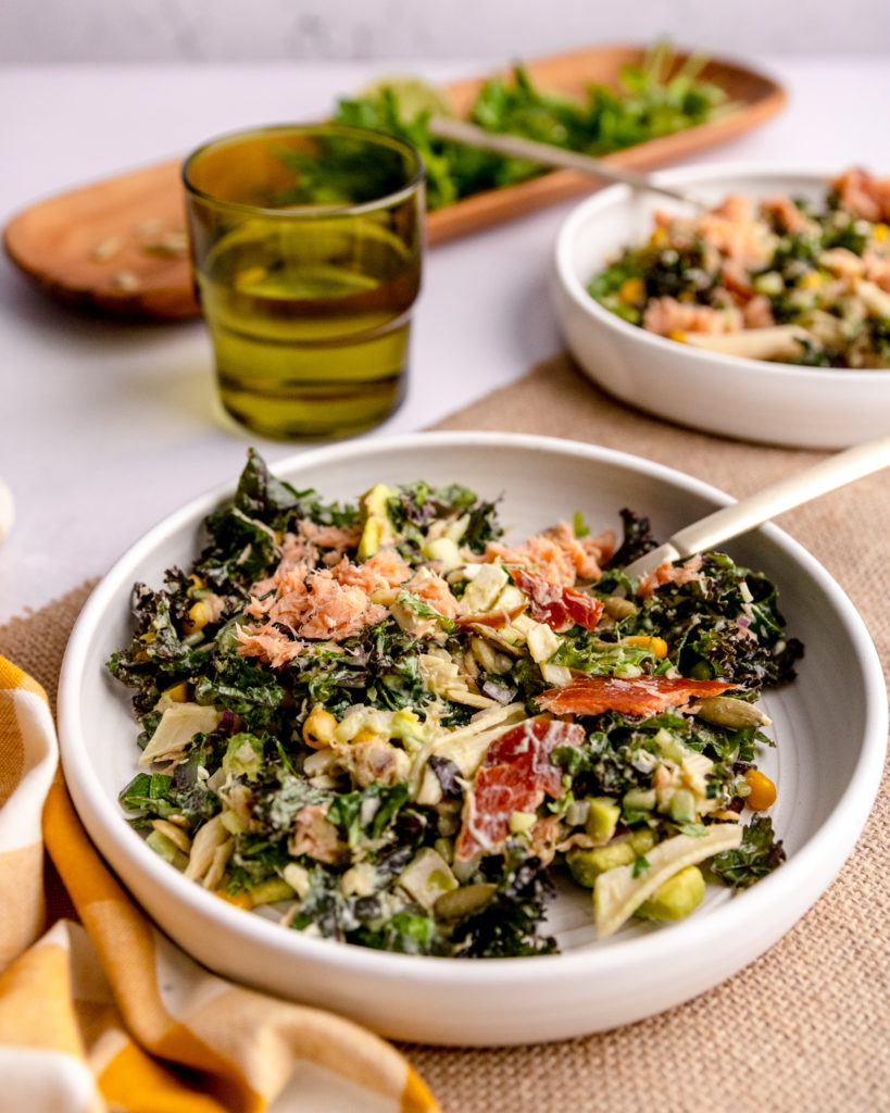 view of smoked salmon salad on a table in white stone serveware